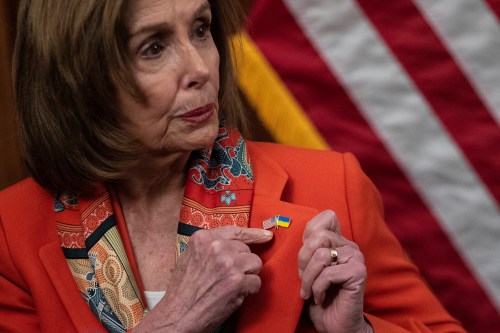 U.S. House Speaker Nancy Pelosi (D-CA) displays a pin, depicting the U.S. and Ukrainian flags, on her jacket, following Russia's invasion of Ukraine, on Capitol Hill in Washington, U.S. March 2, 2022. REUTERS/Tom Brenner