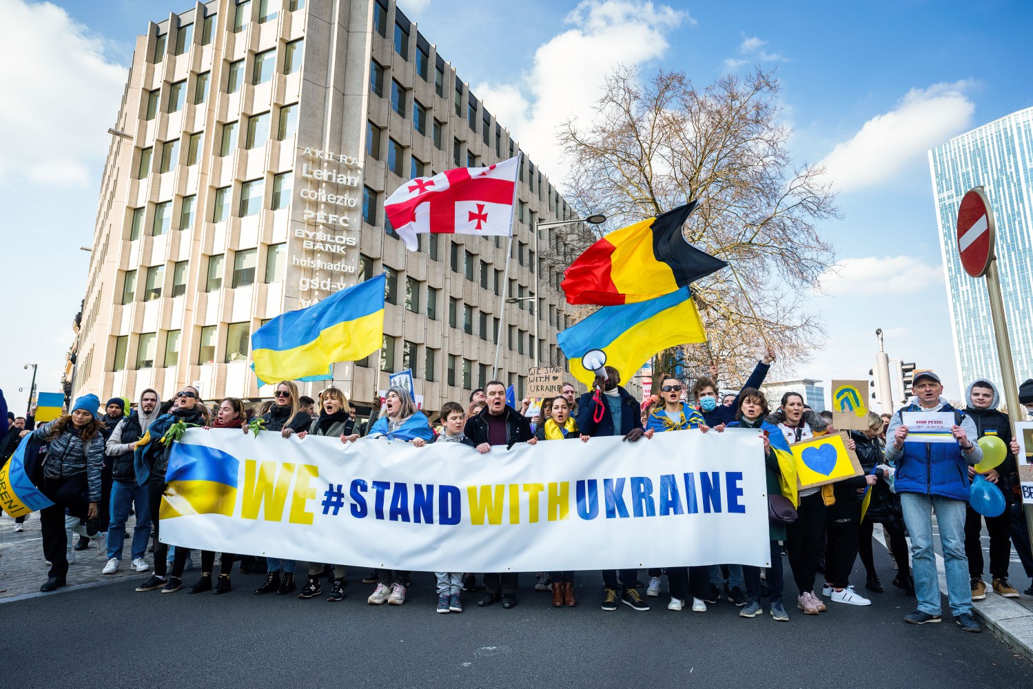 Demonstrators wave the national flags of Ukraine, Georgia and Belgium during the demonstration.Thousands of people joined the demonstration in solidarity with Ukraine in the capital of Belgium. They demand the Russian to stop the invasion of Ukraine and the western nations to set up a no fly zone over Ukrainian airspaces. (Photo by Geovien So / SOPA Images/Sipa USA)No Use Germany.