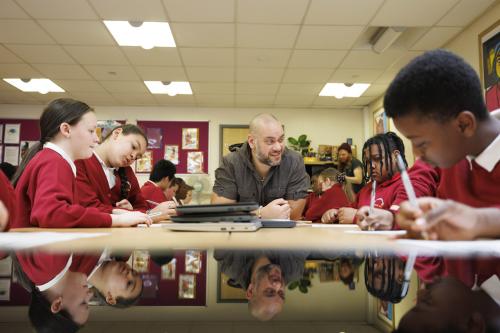 Teacher, Jon Samuel with pupils from Primrose Hill Primary School in Salford take part in one Electronic Arts' new educational workshops designed to inspire children to consider Science, Technology, Engineering and Mathematic careers. Issue date: Wednesday March 23, 2022. Electronic Arts' collaboration with not-for-profit organisation, Digital Schoolhouse (DSH) is a computing workshop aimed at primary-school students, working with video game Knockout City to explore what it takes to teach an AI to play dodgeball. Electronic Arts is also working with education technology company, EVERFI to bring its free cloud-based education course EA Play to Learn to the UK, which targets secondary school pupils and showcases how STEAM skills would be applied in a real-life Game Design Team. Photo credit should read: Ryan Browne/PA Wire.No Use UK. No Use Ireland. No Use Belgium. No Use France. No Use Germany. No Use Japan. No Use China. No Use Norway. No Use Sweden. No Use Denmark. No Use Holland. No Use Australia.