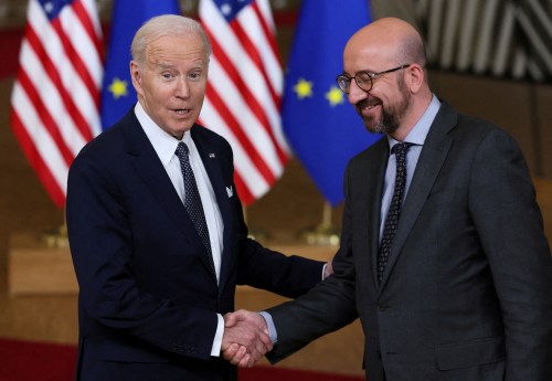 U.S. President Joe Biden and European Council President Charles Michel shake hands, during a European Union leaders summit, amid Russia's invasion of Ukraine, in Brussels, Belgium, March 24, 2022. REUTERS/Evelyn Hockstein