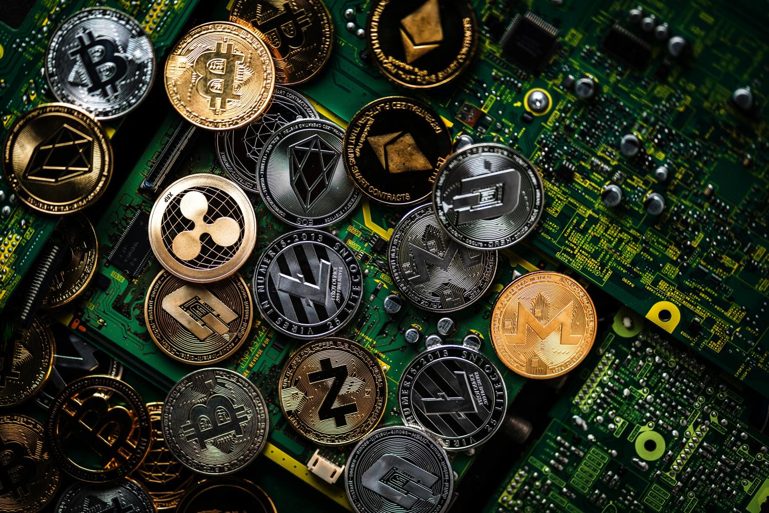 Illustration of digital currencies on top of a motherboard.