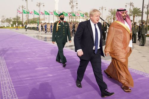 British Prime Minister Boris Johnson is welcomed by Saudi Crown Prince, Mohammed bin Salman, ahead of a meeting at the Royal Court, during a one-day visit to Saudi Arabia and United Arab Emirates, following Russia's invasion of Ukraine, in Riyadh, Saudi Arabia, March 16, 2022. Stefan Rousseau/Pool via REUTERS