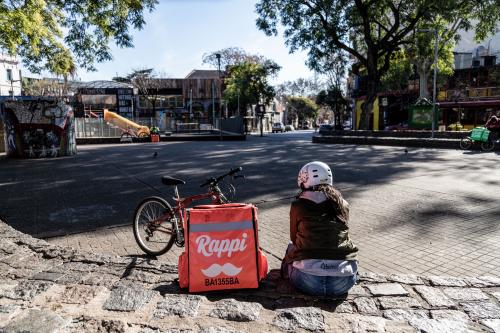 The touristic and empty Serrano Square in the Palermo neighborhood with a delivery Rappi waiting for the next course. Argentina extended their lockdown through July 17, leaving the country's tourism industry reeling. Buenos Aires, Argentina - July 6, 2020.La place Serrano, vide dans le quartier touristique de Palermo. Une livreuse Rappi est assise en attendant la prochaine commandeL Argentine a prolonge le confinement jusqu au 17 juillet, impactant fortement l industrie du tourisme. Buenos Aires, Argentina - 6 juillet 2020.NO USE FRANCE