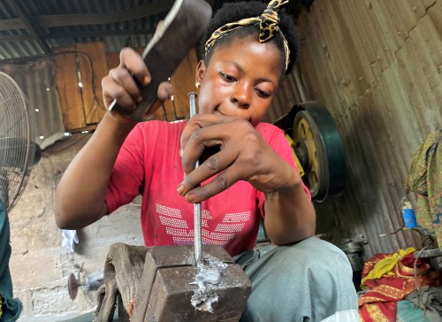 A woman works on a mould at the makeshift workshop of Nigerian entrepreneur, Ukamaka Okoye, in the southeastern town of Nnewi, Anambra state, Nigeria September 19, 2020. Picture taken September 19, 2020.  REUTERS/Seun Sanni