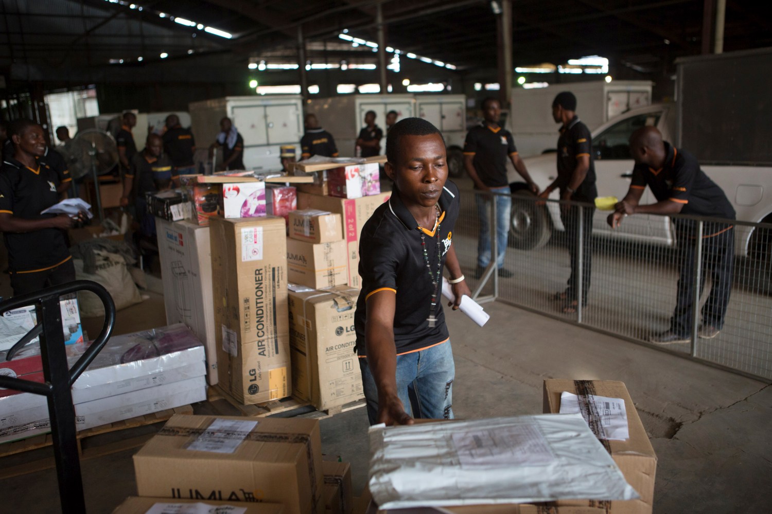 An employee of online retailer Jumia sorts packages for delivery at the company's warehouse in Lagos February 16, 2015. The growth of Africa's middle class has created demand for products that conventional retail struggles to satisfy due to a shortage of malls and grinding traffic in many cities that deters shoppers. The sector is still in its infancy. The internet's contribution to Africa's gross domestic product stood at 1.1 percent in 2013, much lower than other emerging markets. But this could rise to 10 percent, or $300 billion, by 2025, according to a report by consultants McKinsey's & Company. REUTERS/Joe Penney (NIGERIA - Tags: BUSINESS SOCIETY EMPLOYMENT)