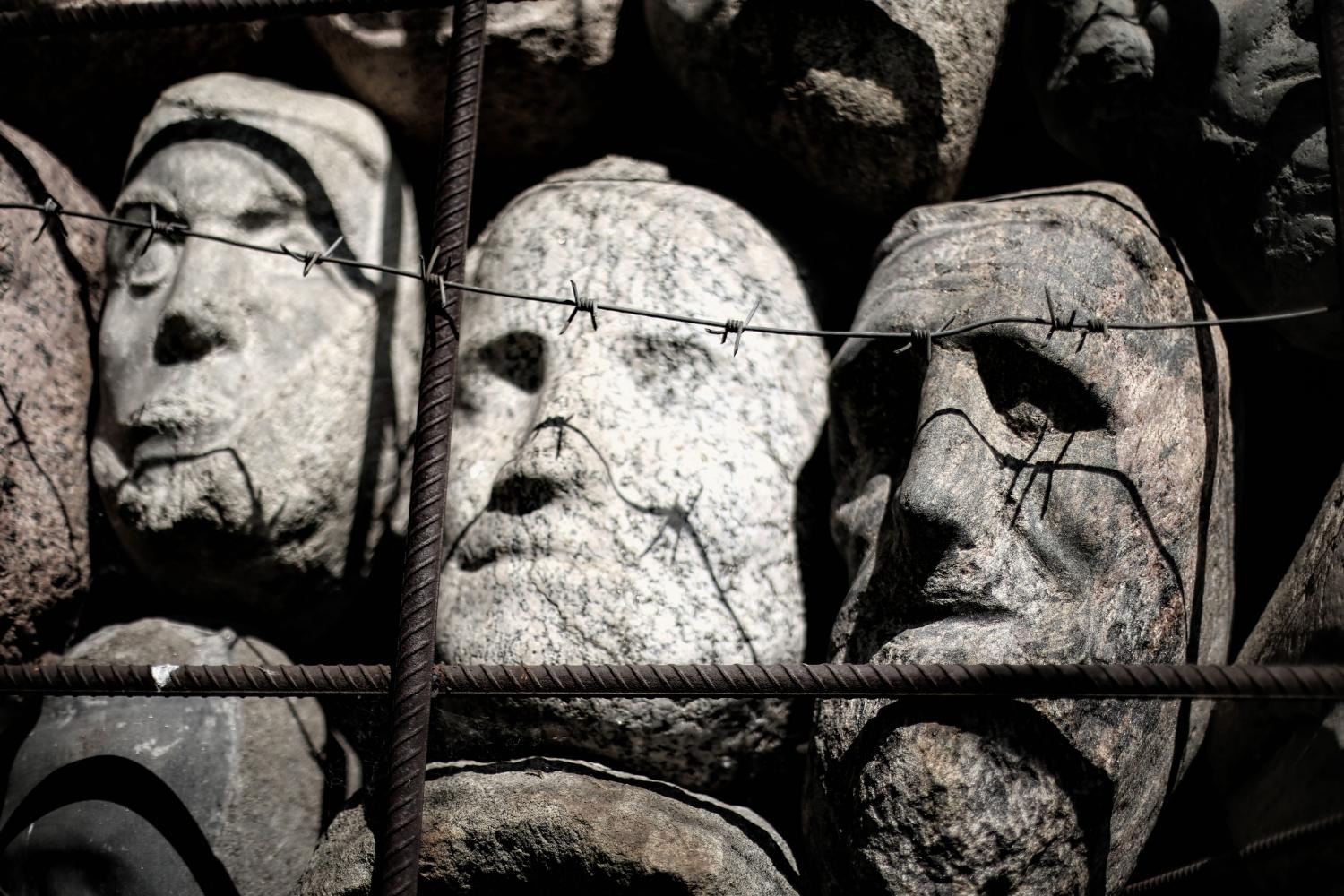 MOSCOW - JUNE 7, 2016 a monument to the victims of totalitarian regimes in the park in Moscow, stone faces in suffering