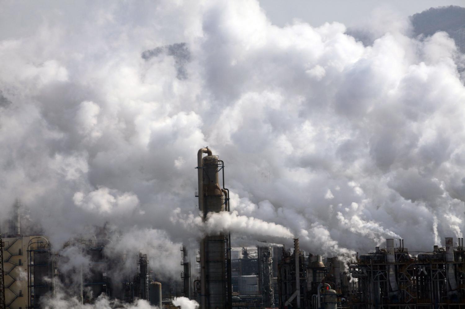 --FILE--Heavy smoke is discharged from chimneys at an ethylene plant of PetroChina in Jilin city, northeast China's Jilin province, 18 February 2012.When the 2009 Copenhagen climate summit ended without reaching a legally binding deal to limit greenhouse gas emissions, China was demonised for wrecking the negotiations. Six years later, the world's largest carbon emitter has become an unlikely leader in the international dialogue. China is now praised for its plans to tackle climate change ¨C by peaking its greenhouse gas emissions by 2030, reducing its dependence on fossil fuels, and helping poor countries adapt to global warming. The changes, made possible by economic restructuring and public pressure to tackle pollution, come as the country ¨C now the world's second-largest economy ¨C straddles the division between developing and developed nations.No Use China. No Use France.