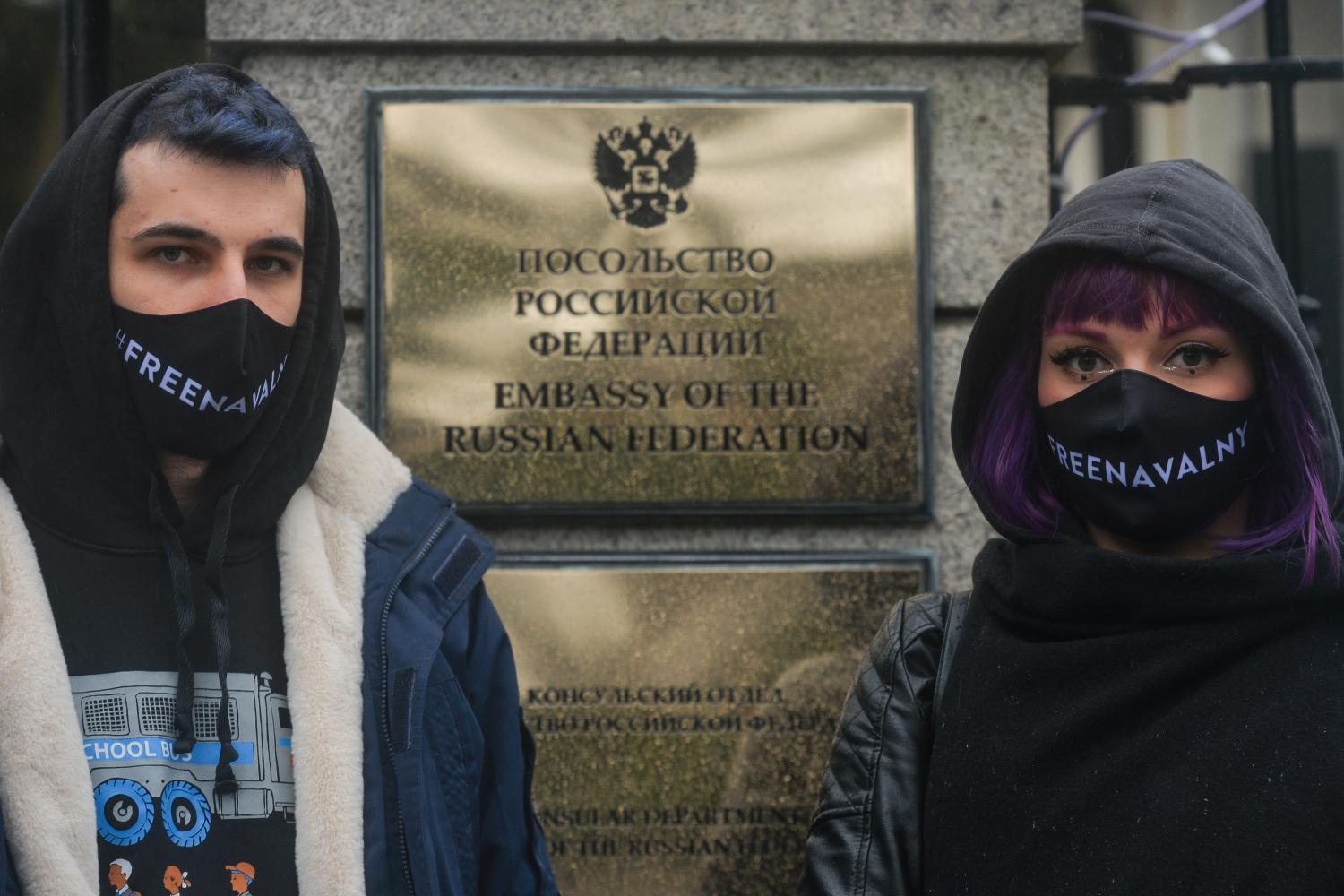 Protesters wearing a 'Free Navalny' face masks seen during a symbolic rally in support of the imprisoned Russian opposition leader Alexei Navalny