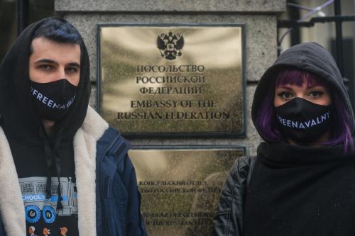 Protesters wearing a 'Free Navalny' face masks seen during a symbolic rally in support of the imprisoned Russian opposition leader Alexei Navalny