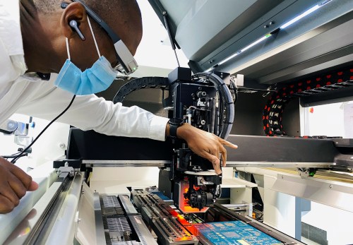 Latif Cherono, electronics manufacturing manager at the innovation lab called Gearbox for entrepreneurs and artisans, works on the Surface-mount technology (SMT) line at the Industrial area in Nairobi, Kenya March 15, 2021. Picture taken March 15, 2021. REUTERS/Jackson Njehia