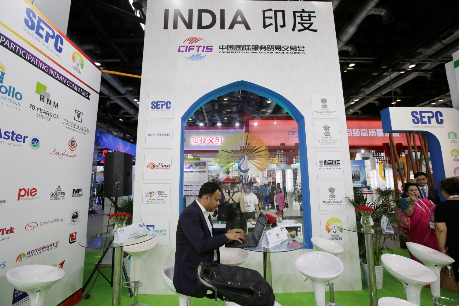 A man works at India's booth during China International Fair for Trade in Services in Beijing, China, May 27, 2019. REUTERS/Jason Lee