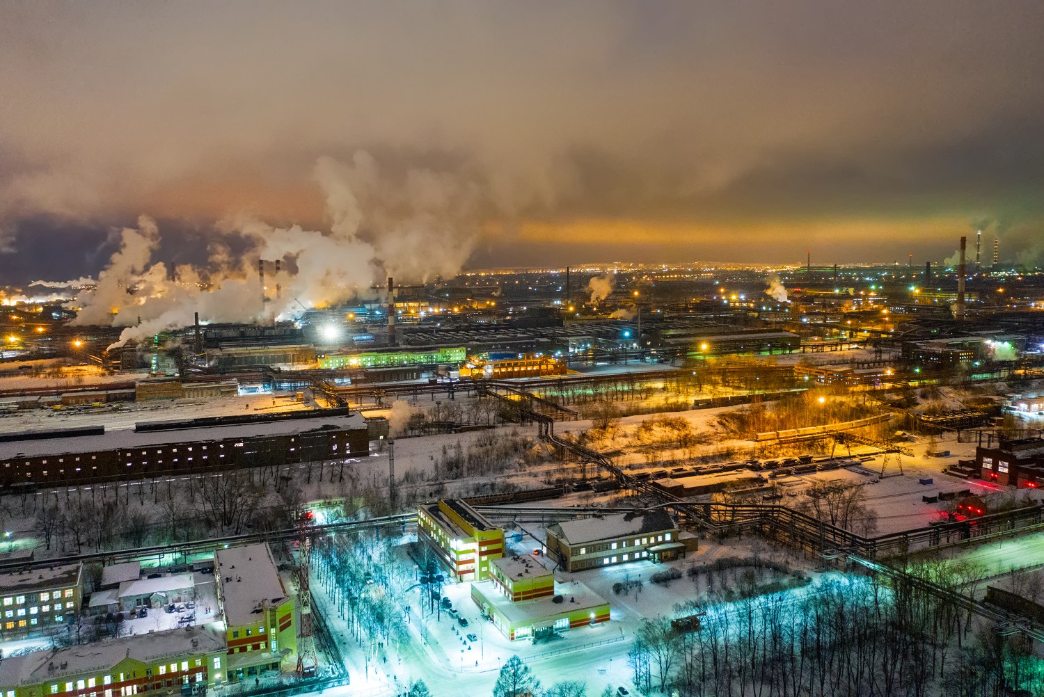 Evening view of smoke billowing from an industrial zone