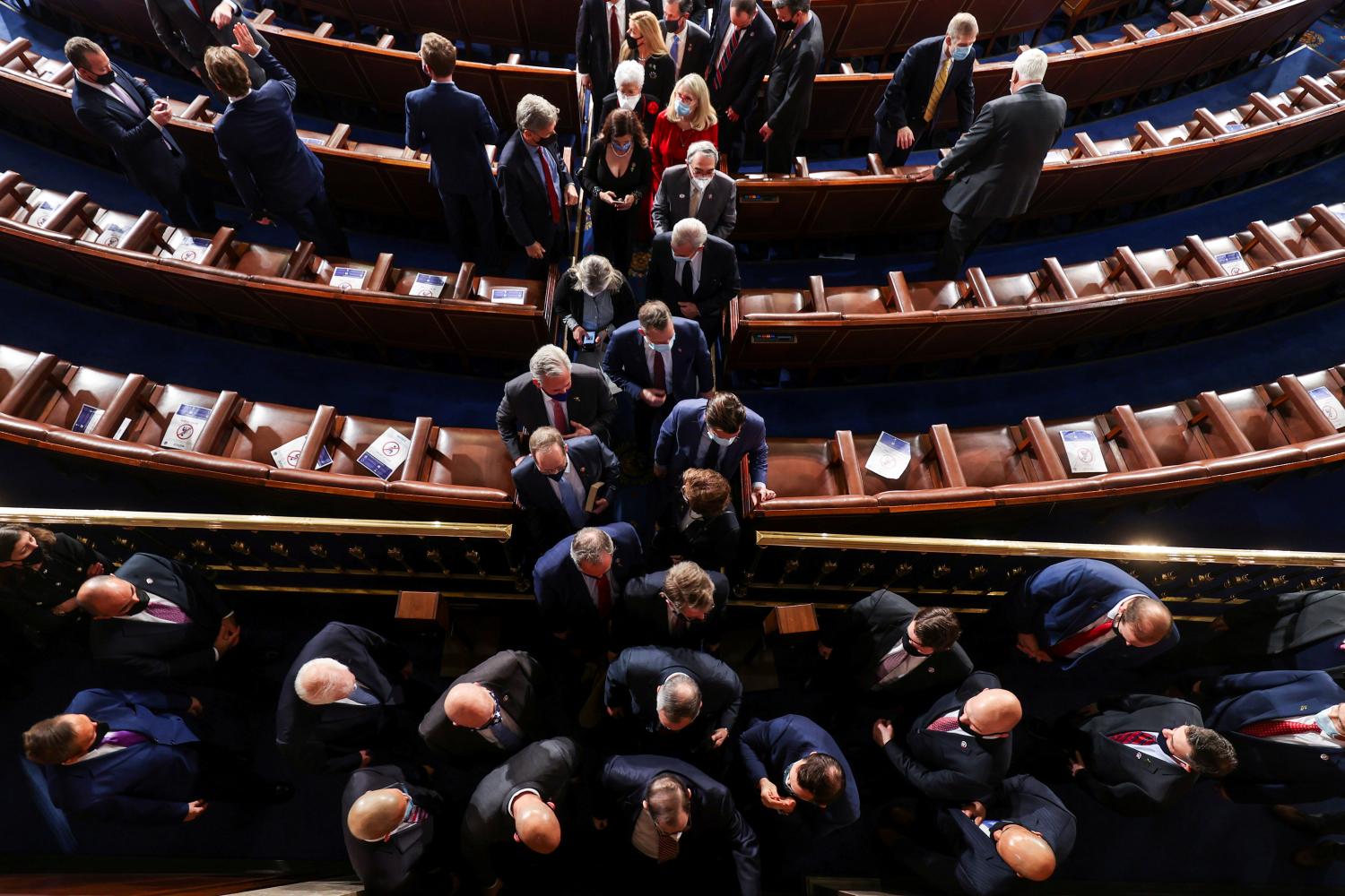 Members of the house depart after the first session of the 117th Congress in the House Chamber at the U.S. Capitol in Washington, DC, U.S., January 3, 2021. Tasos Katopodis/Pool via REUTERS