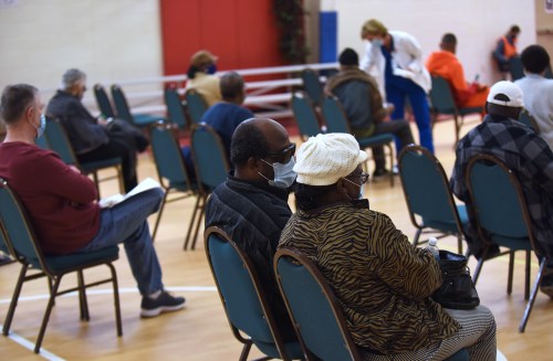 People sit in the observation area after receiving a dose of the Pfizer COVID-19 vaccine at Shiloh Baptist church on March 7, 2021 in Orlando, Florida. The one-day outreach to the Black community in the Parramore neighborhood hoped to administer 600 vaccines to local residents.  (Photo by Paul Hennessy/NurPhoto)NO USE FRANCE