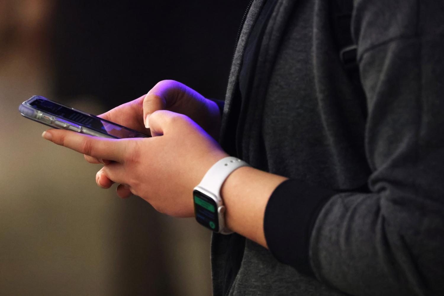 A person uses a smartphone in Manhattan, New York City, U.S., February 11, 2022. REUTERS/Andrew Kelly