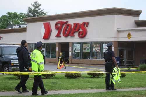 Members of the Buffalo Police department work at the scene of a shooting at a Tops supermarket in Buffalo, New York, U.S. May 16, 2022. REUTERS/Brendan McDermid