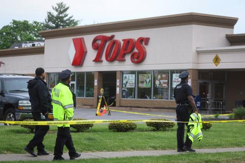 Members of the Buffalo Police department work at the scene of a shooting at a Tops supermarket in Buffalo, New York, U.S. May 16, 2022. REUTERS/Brendan McDermid