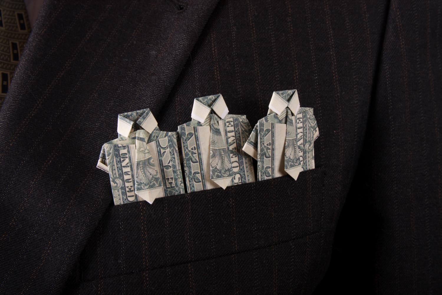 Dollar bills folded into origami suits
