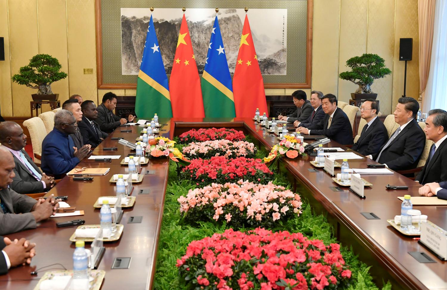 Solomon Islands Prime Minister Manasseh Sogavare speaks with Chinese President Xi Jinping during their meeting at the Diaoyutai State Guesthouse in Beijing, China, October 9, 2019. Parker Song/Pool via REUTERS