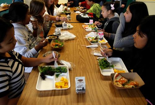 Students sit down to eat a healthy lunch at Marston Middle School in San Diego, California, March 7, 2011. San Diego's Healthy Works Project received the countries largest grant, 16 million dollars,  from the American Recovery and Reinvestment Act 2009 to help combat obesity.  REUTERS/Mike Blake  (UNITED STATES - Tags: EDUCATION SOCIETY HEALTH FOOD)