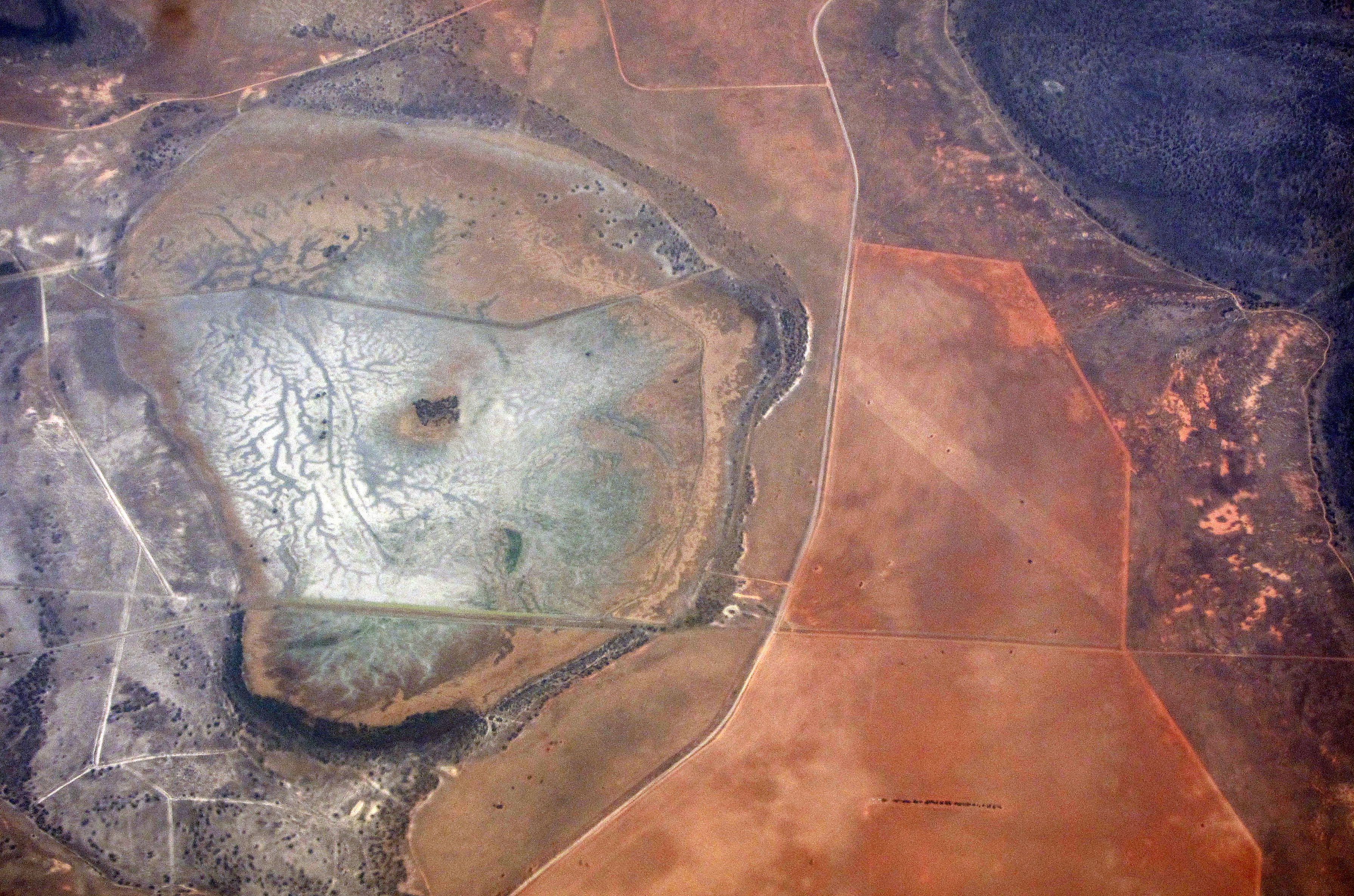 A salt-affected water catchment area can be seen amongst drought affected farmland in south Australia, November 26, 2015. This year will be the hottest on record and 2016 could be even hotter due to the El Niño weather pattern, the World Meteorological Organization said on Wednesday, warning that inaction on climate change could see global average temperatures rise by 6 degrees Celsius or more. Global ocean temperatures were unprecedented during the period, and several land areas, including the continental United States, Australia, Europe, South America and Russia, broke temperature records by large margins.    REUTERS/David Gray