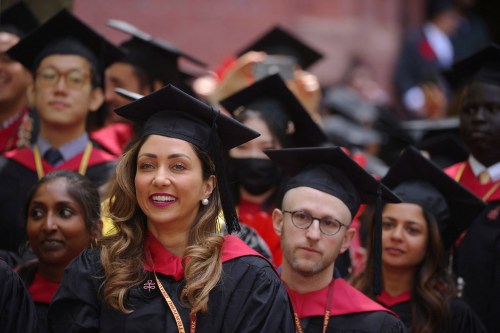 Students from the School of Public Health listen as they graduate during Harvard University's 371st Commencement Exercises in Cambridge, Massachusetts, U.S., May 26, 2022.   REUTERS/Brian Snyder