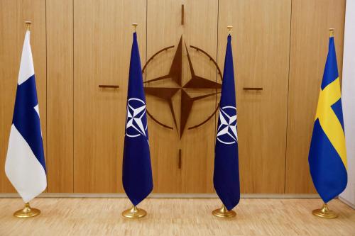 FILE PHOTO: A view of the flags of Finland, NATO and Sweden during a ceremony to mark Sweden's and Finland's application for membership in Brussels, Belgium, May 18, 2022. REUTERS/Johanna Geron/Pool/File Photo