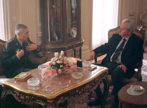 Yugoslav President Slobodan Milosevic (R) listens to NATO Supreme Allied Commander General Wesley Clark (L) during talks in Belgrade late January 19. General Clark held crisis talks with Milosevic on Tuesday but made no progress of softening its policy on Kosovo, diplomatic sources said. Clark said the visit to Belgrade to see Milosevic was not a failure and that the meeting accomplished what it set out to do.PEK/
