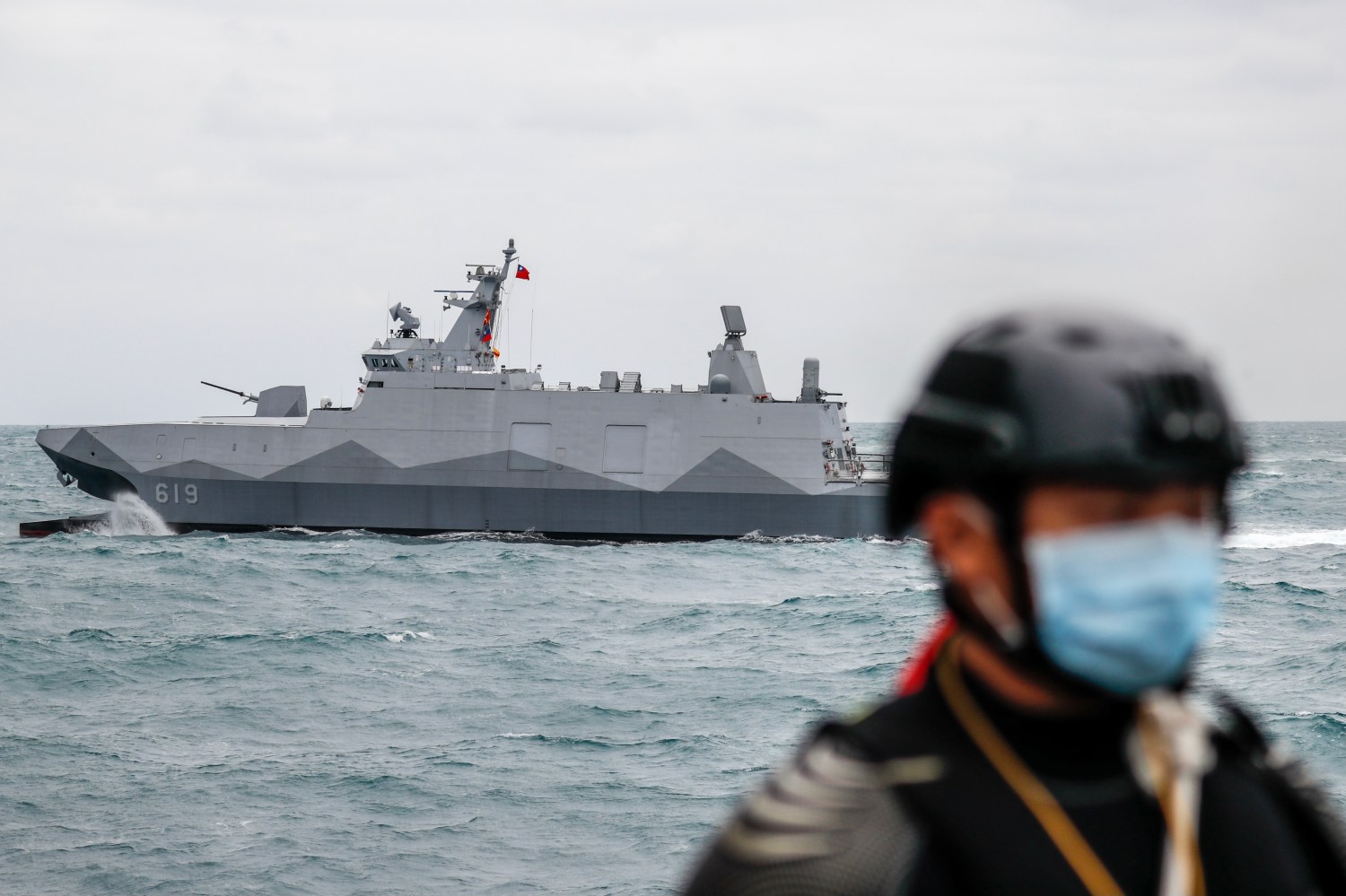 A Taiwanese military corvette sails as a Navy soldier stands guard on a vessel, during a Navy Drill for Preparedness Enhancement ahead of the Chinese New Year, amid escalating Chinese threats to the island, in Keelung, Taiwan, 7 Jan, 2022. With the US approving an increasing number of arms sales to Taipei and China sending more PLA warplanes to cruise around the self governing island, military tensions in the Taiwan Strait have been expected to grow. (Photo by Ceng Shou Yi/NurPhoto)