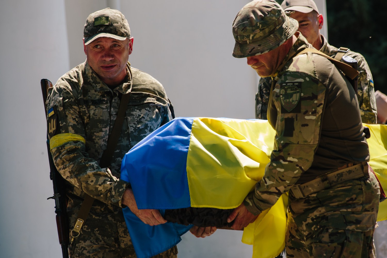 The Armed Forces of Ukraine are carrying the coffin of the dead Ukrainian serviceman in Poltava, Ukraine, on June 10, 2022. (Photo by Pavlo Pakhomenko/NurPhoto)