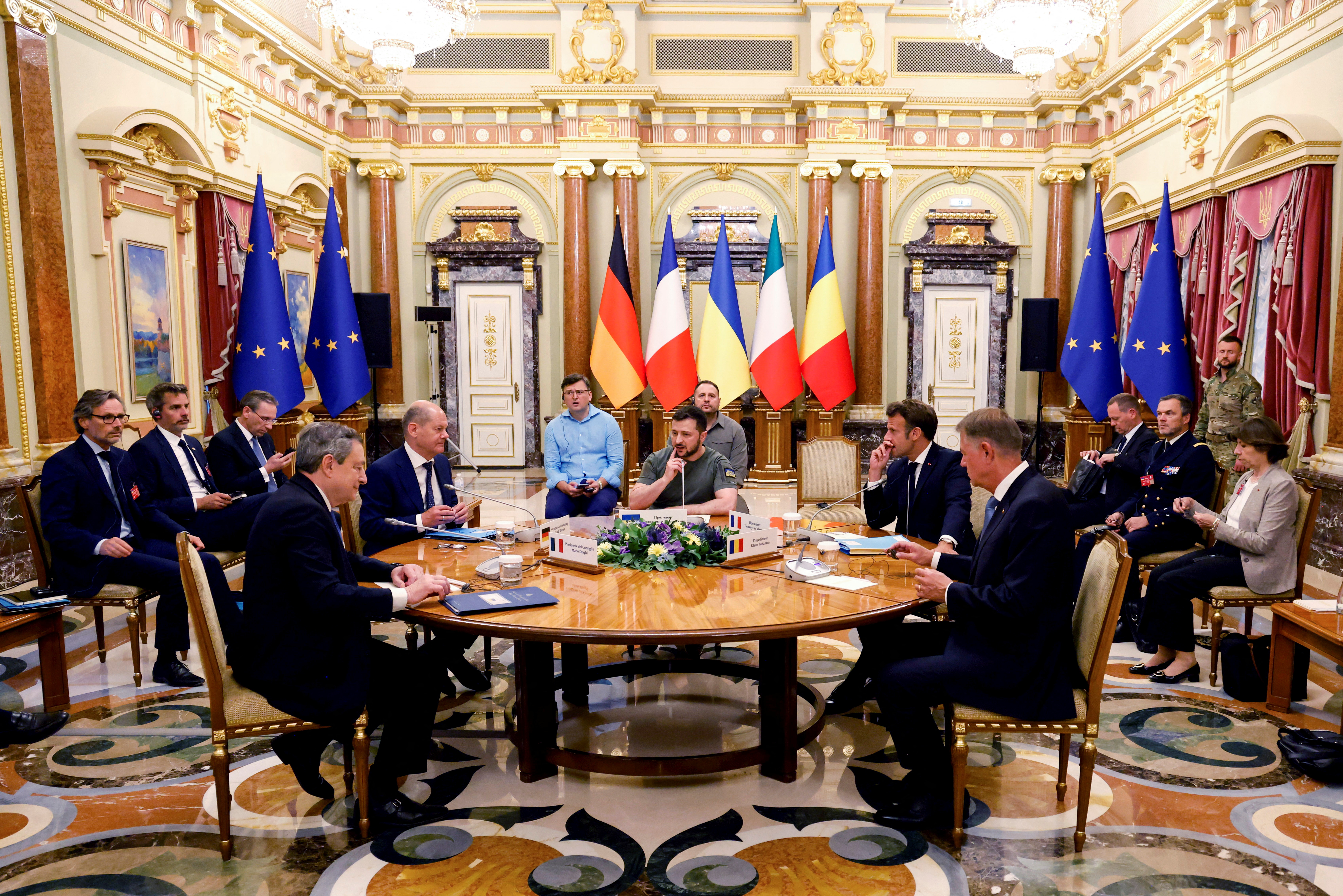 Ukrainian President Volodymyr Zelenskiy, France's President Emmanuel Macron, Italian Prime Minister Mario Draghi, German Chancellor Olaf Scholz and Romanian President Klaus Iohannis meet for a working session in Mariinsky Palace, in Kyiv, Ukraine June 16, 2022. Ludovic Marin/Pool via REUTERS