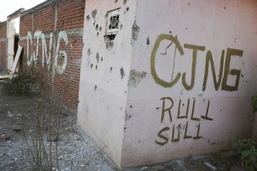 A bullet-riddled facade with the acronym of the Jalisco New Generation Cartel (CJNG) is pictured in El Aguaje after the visit of Vatican's ambassador to Mexico Franco Coppola to the area and to the municipality of Aguililla, an area where the Jalisco New Generation Cartel (CJNG) and local drug gangs are fighting to control the territory, in Michoacan state, Mexico April 23, 2021. REUTERS/Alan Ortega