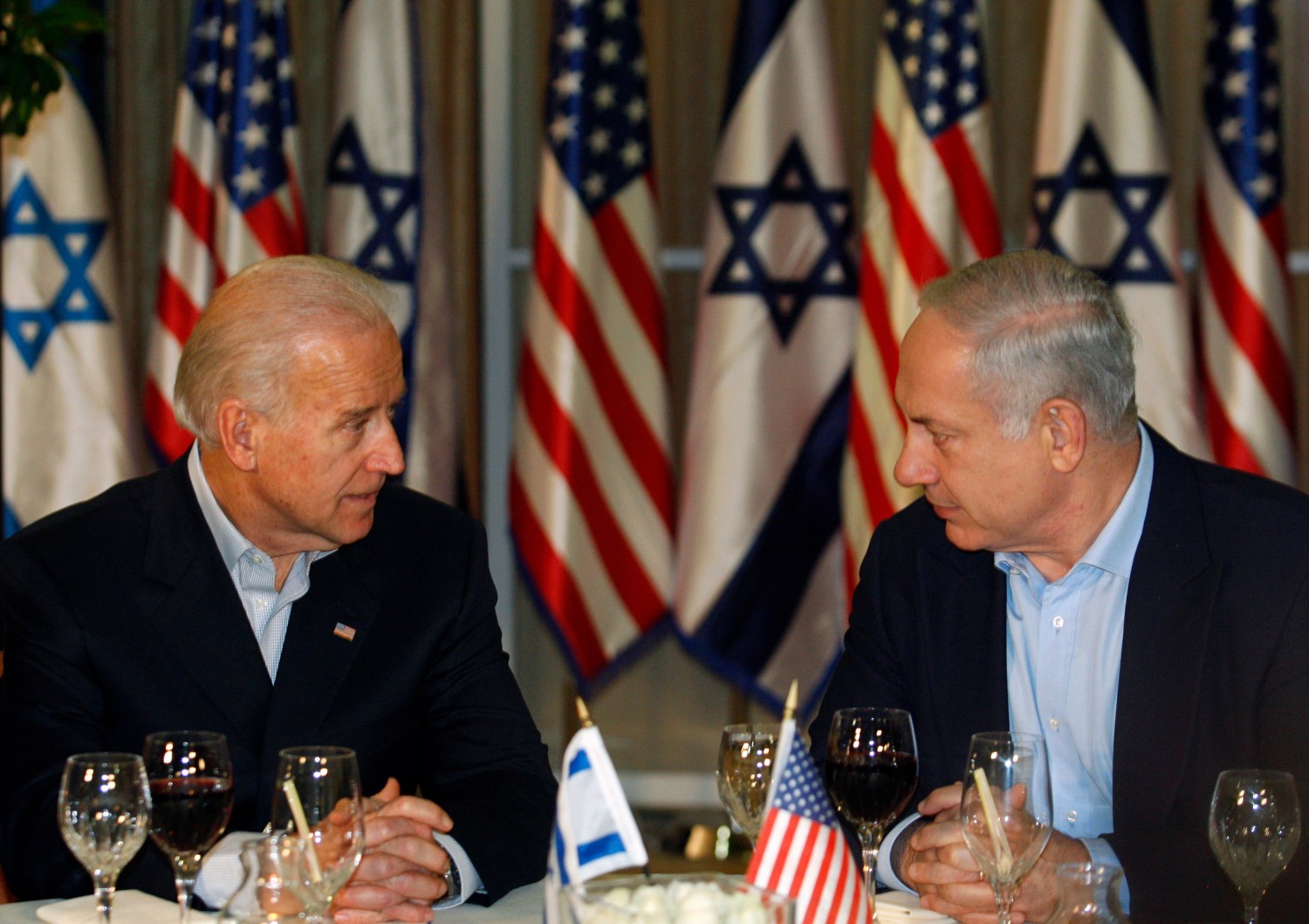 U.S. Vice President Joe Biden sits with Israel's Prime Minister Benjamin Netanyahu (R) before a dinner at the Prime Minister's residence in Jerusalem March 9, 2010. Biden assured Israel on Tuesday of Washington's commitment to its security and preventing Iran from producing nuclear weapons. REUTERS/Baz Ratner (JERUSALEM - Tags: POLITICS)