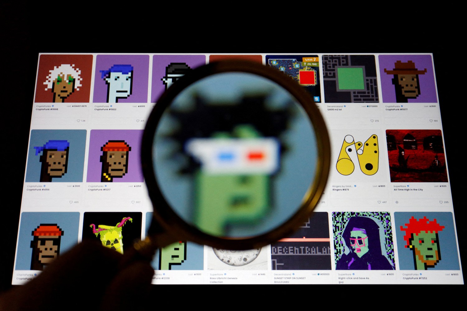 FILE PHOTO: A non-fungible token (NFT) displayed on the website of NFT marketplace OpenSea is seen through a magnifying glass, in this illustration picture taken February 28, 2022. REUTERS/Florence Lo/Illustration/File Photo