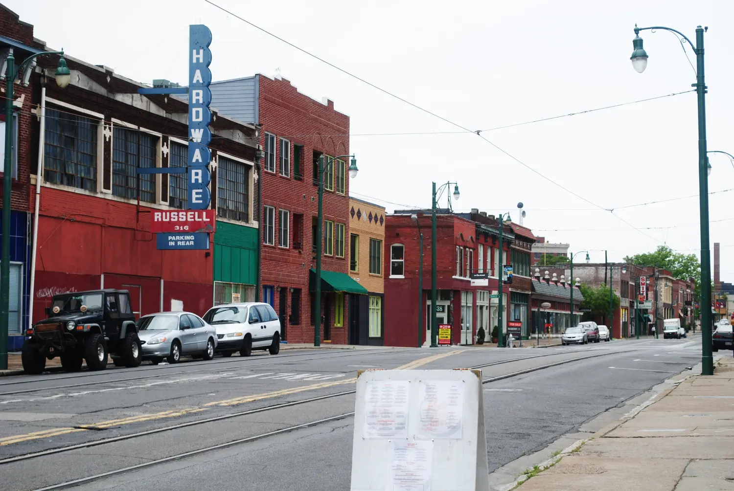 Street with hardware store and other retail store fronts