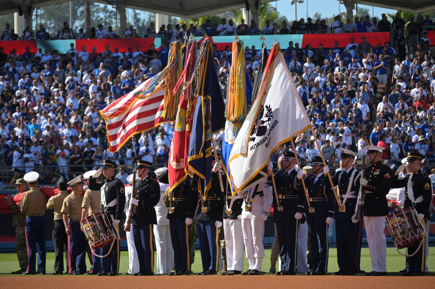 Jul 19, 2022; Los Angeles, California, USA; Members of the military present the flag during the national anthem before the game between the American League and the National League at Dodger Stadium. Mandatory Credit: Jayne Kamin-Oncea-USA TODAY Sports