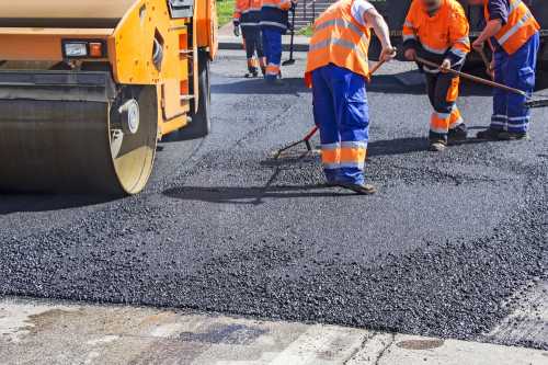 Roller,And,Workers,On,Asphalting,And,Repair,Of,City,Streets