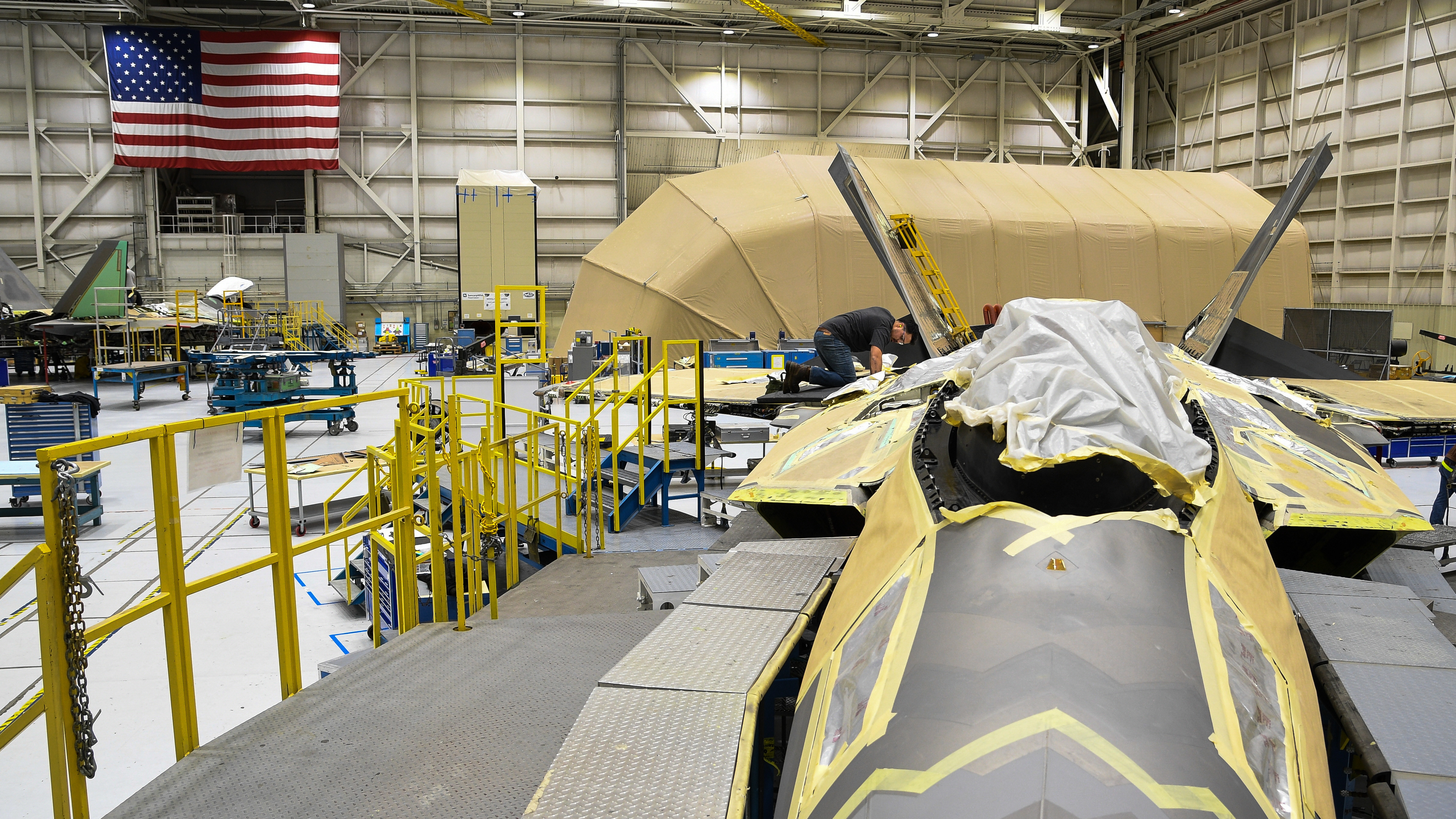 A 574th Aircraft Maintenance Sqaudron maintainer performs depot maintenance on F-22 fighter jet at Hill Air Force Base, Utah, Jan. 16, 2018. The 574th installed the first metallic 3D printed part on an operational F-22 in December. (U.S. Air Force photo by R. Nial Bradshaw)