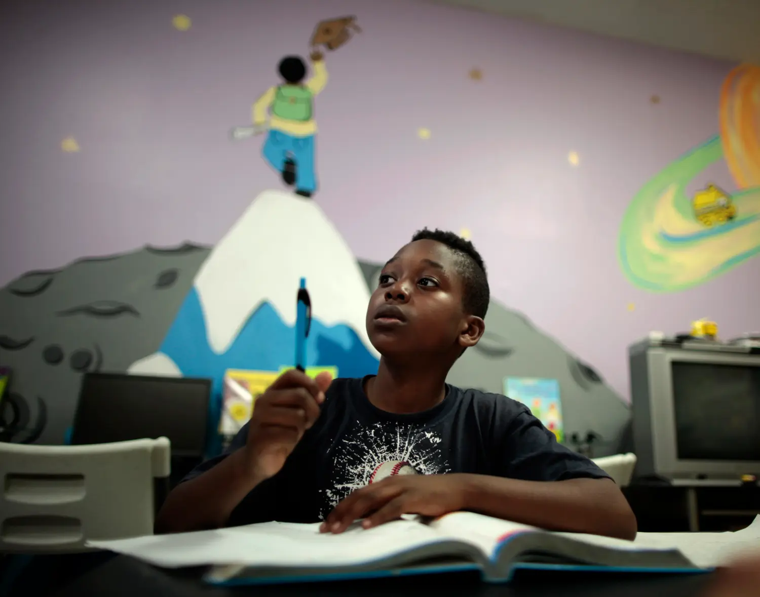 James, 10, calls for a tutor at South Los Angeles Learning Center in Los Angeles, California March 16, 2011. The center is run by School on Wheels, which uses volunteers to tutor homeless children in shelters, parks, motels, and two centers. There has been a surge in the number of homeless children in Los Angeles in the last five years, due to persistent unemployment and mounting foreclosures. REUTERS/Lucy Nicholson (UNITED STATES - Tags: SOCIETY EDUCATION)