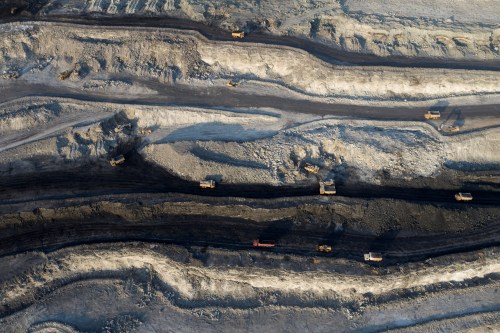 An aerial view shows machinery working in an open-pit coal mine in Ejin Horo Banner, Ordos, Inner Mongolia Autonomous Region, China, October 19, 2021. Picture taken with a drone. China Daily via REUTERS  ATTENTION EDITORS - THIS IMAGE WAS PROVIDED BY A THIRD PARTY. CHINA OUT. NO COMMERCIAL OR EDITORIAL SALES IN CHINA