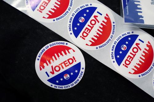 An election worker wears stickers on election day in the Manhattan borough of New York City, New York, U.S., November 2, 2021. REUTERS/Carlo Allegri