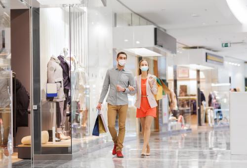 Couple shopping with surgical masks on