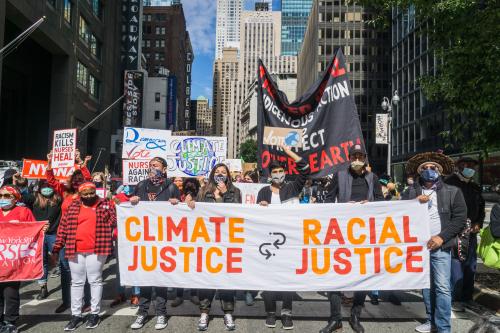 Group of activists for climate justice and racial justice marching the streets of New York City