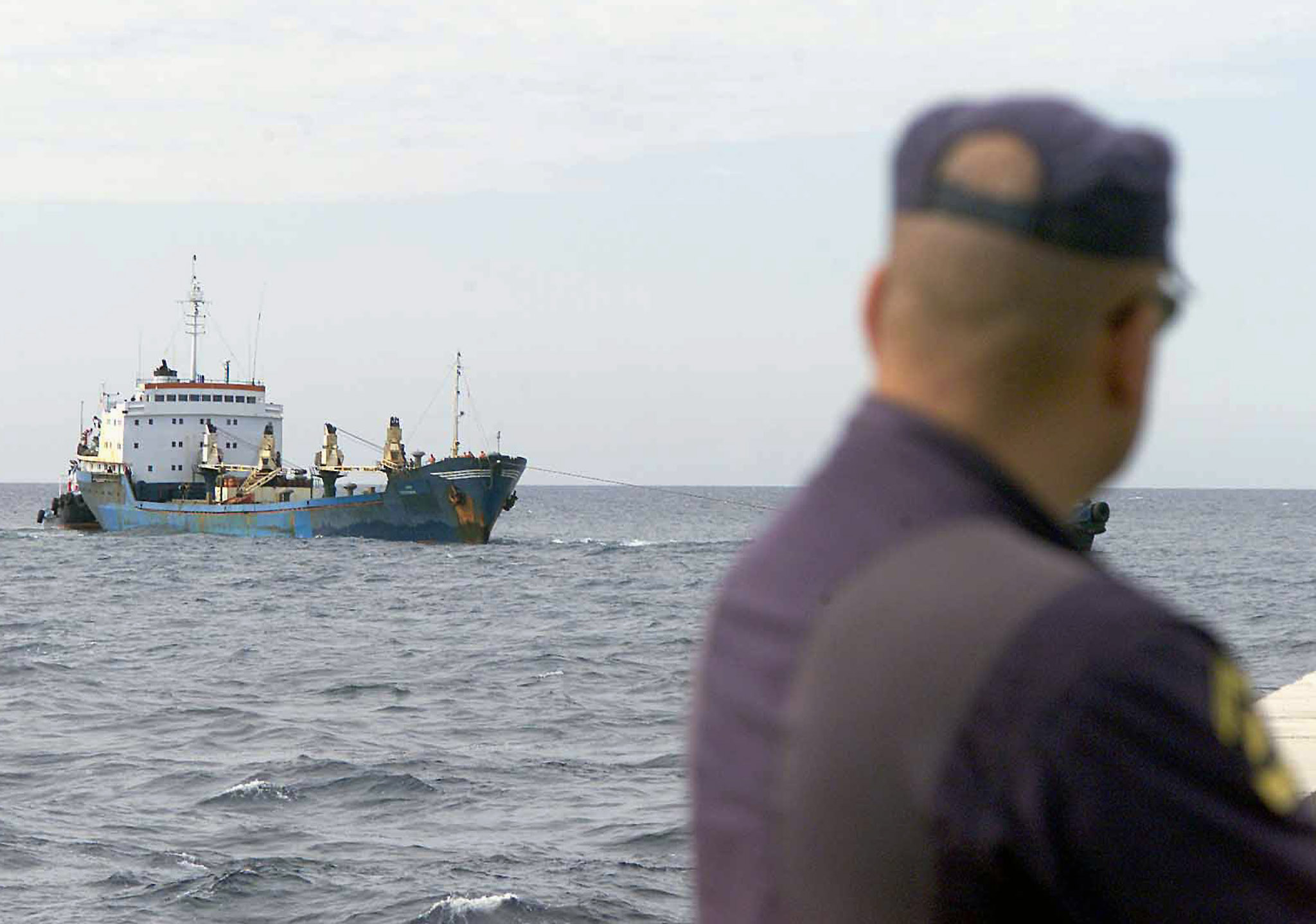 A Spanish policeman watches a vessel arrive in the port of Santa Cruzde Tenerife in the Canary Islands August 30, 2001 during aninternational police operation involving Spain, the U.S. and Canada.Fourteen people were arrested and two boats seized off the coast ofFrench Guiana carrying about five tonnes of cocaine. Spain is a majorEuropean entry point for drugs and contraband coming from North Africaand Latin America. REUTERS/Alex RosaDB
