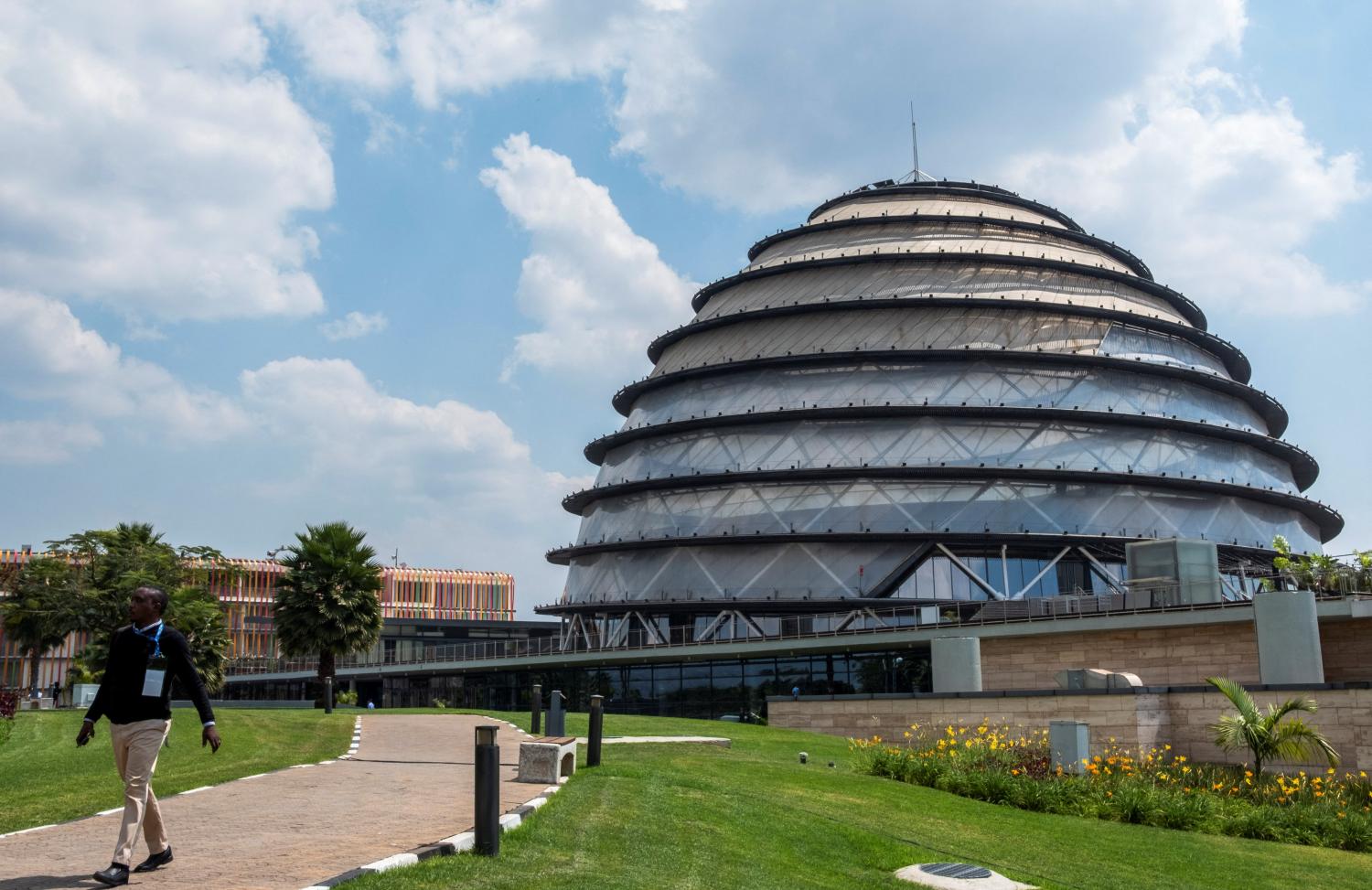 A delegate walks at the Kigali Convention Centre, the venue hosting the Commonwealth Heads of Government Meeting (CHOGM) in Kigali, Rwanda June 22, 2022. REUTERS/Jean Bizimana