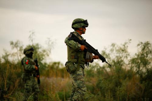 Members of the Mexican army stand guard at the crime scene where unknown assailants left the bodies of dead people on the outskirts of the city, according to local media, in Ciudad Juarez, Mexico August 13, 2022. REUTERS/Jose Luis Gonzalez