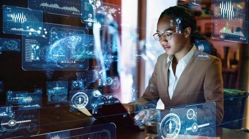 woman working on computer with photo overlays of computer science models