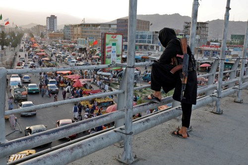 A Taliban fighter stands guard on a bridge in Kabul, Afghanistan, August 6, 2022. REUTERS/Ali Khara     TPX IMAGES OF THE DAY