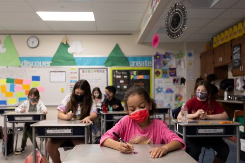 Samantha Wiik's fourth grade class does an activity comparing the positive outcomes of the coronavirus disease (COVID-19) to their word of the week, "celebration" at Kratzer Elementary School in Allentown, Pennsylvania, U.S. April 13, 2021. Students drew on their desks to visually portray this idea with dry erasable markers. Picture taken April 13, 2021. REUTERS/Hannah Beier