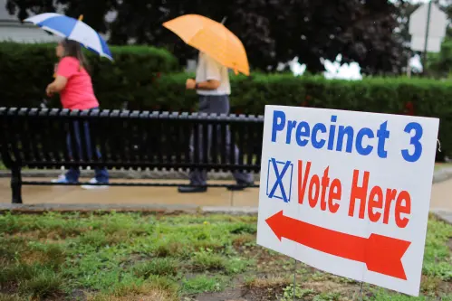 Voters arrive at their polling location on Primary Election day in Rockport, Massachusetts, U.S., September 6, 2022.  REUTERS/Brian Snyder